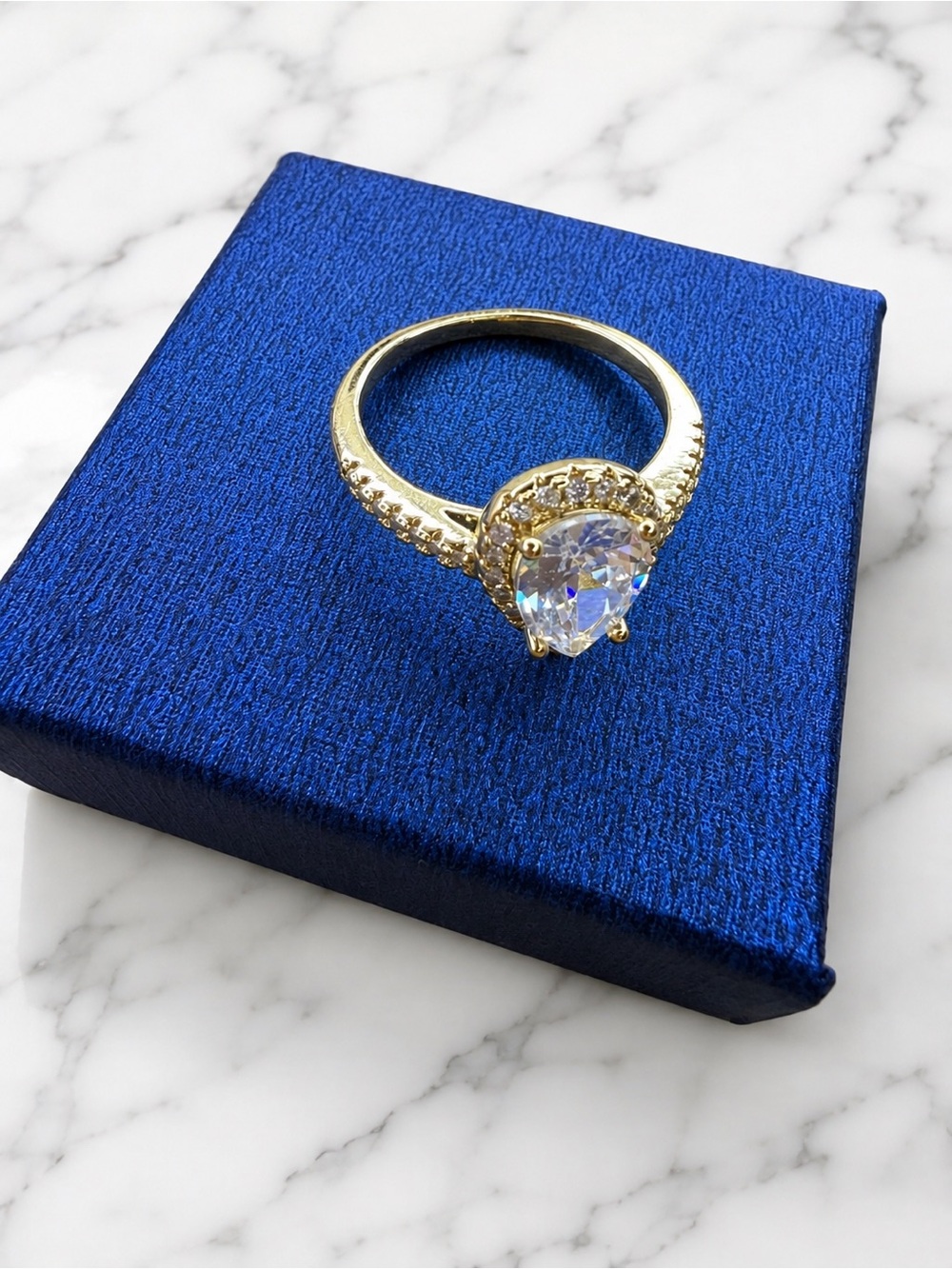 Gold Pear-Cut Halo Ring with Clear Stone. 925 silver. Gold-plated.